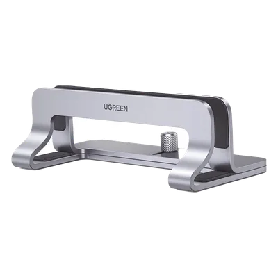 Soporte Vertical para Laptop / Ajustable 12-26 mm / Aluminio y Silicona / Hasta 15.6 pulgadas / Base Antideslizante / Color Plata