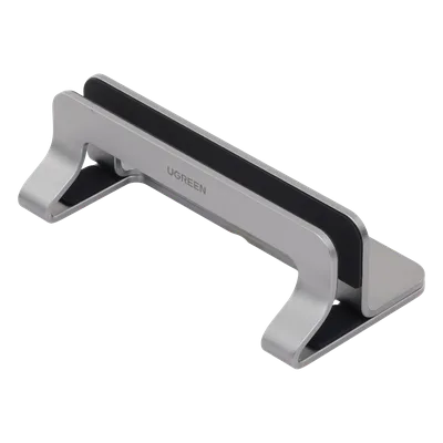 Soporte Vertical para Laptop / Ajustable 12-26 mm / Aluminio y Silicona / Hasta 15.6 pulgadas / Base Antideslizante / Color Plata